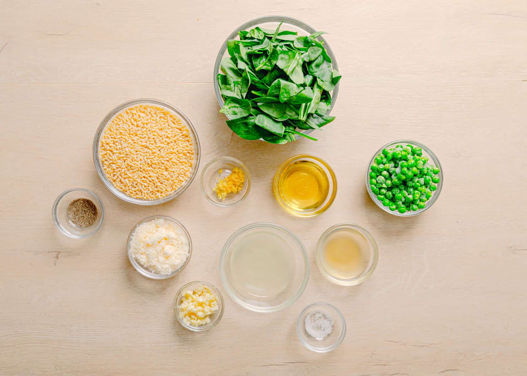 Ingredients for orzo with peas laid out on the counter.